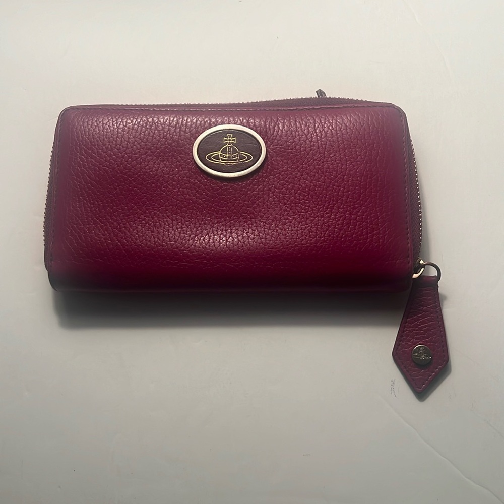 Vivienne Westwood's Zip Round Wallet New condition. Burgundy Red. Stunning!